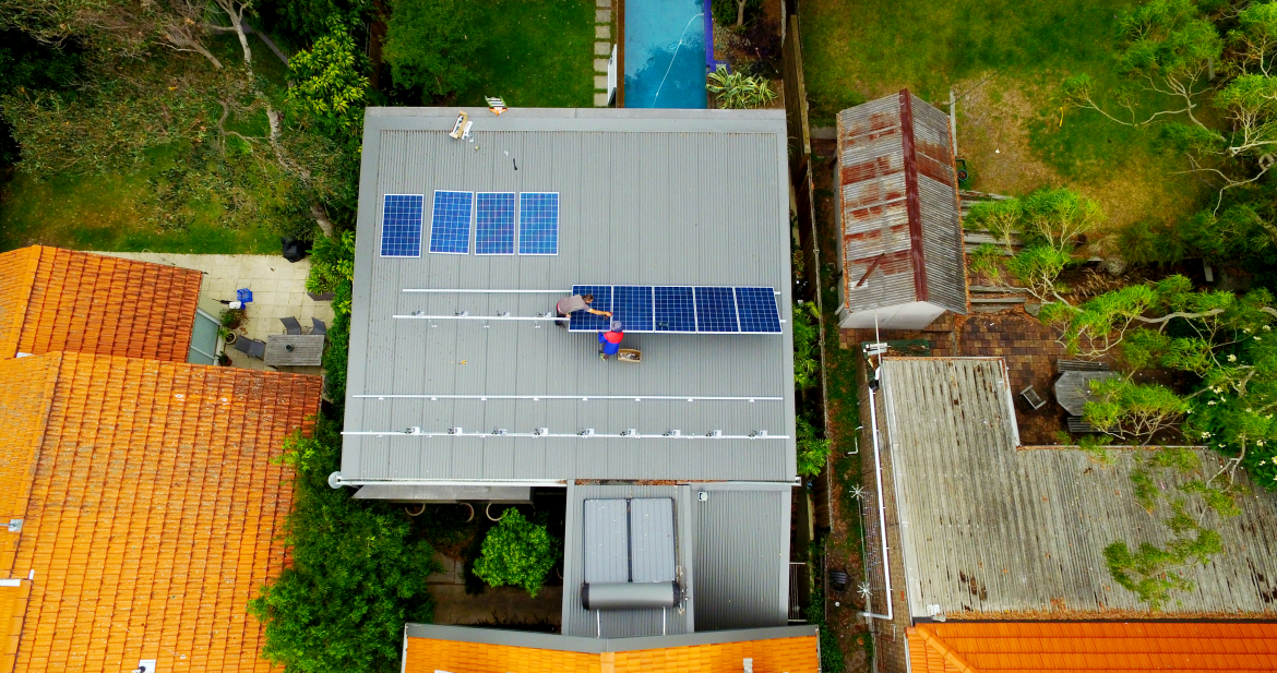 Top view of Solar Panel Installation work done by two people